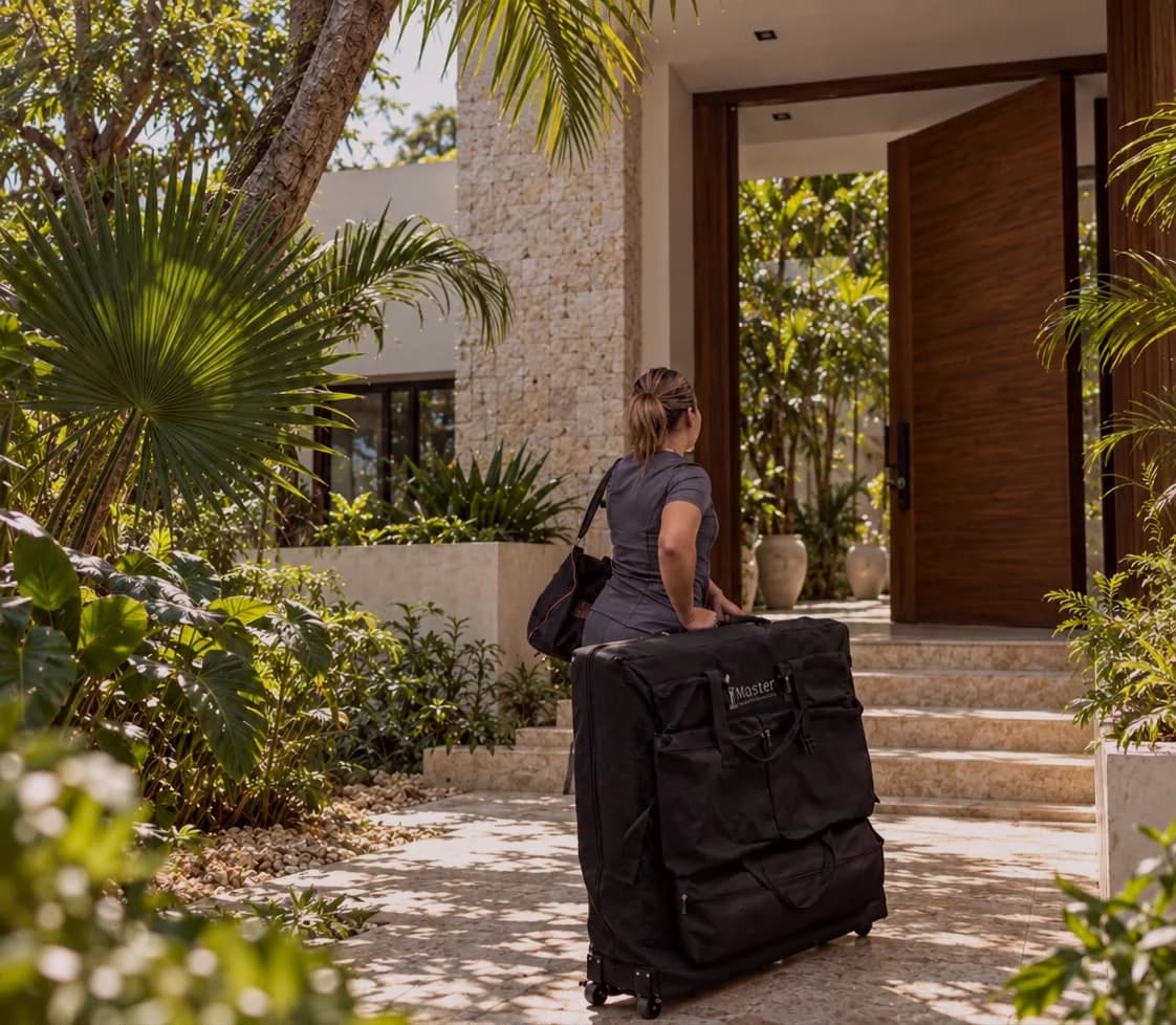 Therapist arriving at a villa with her massage table for an at home massage in Playa del Carmen